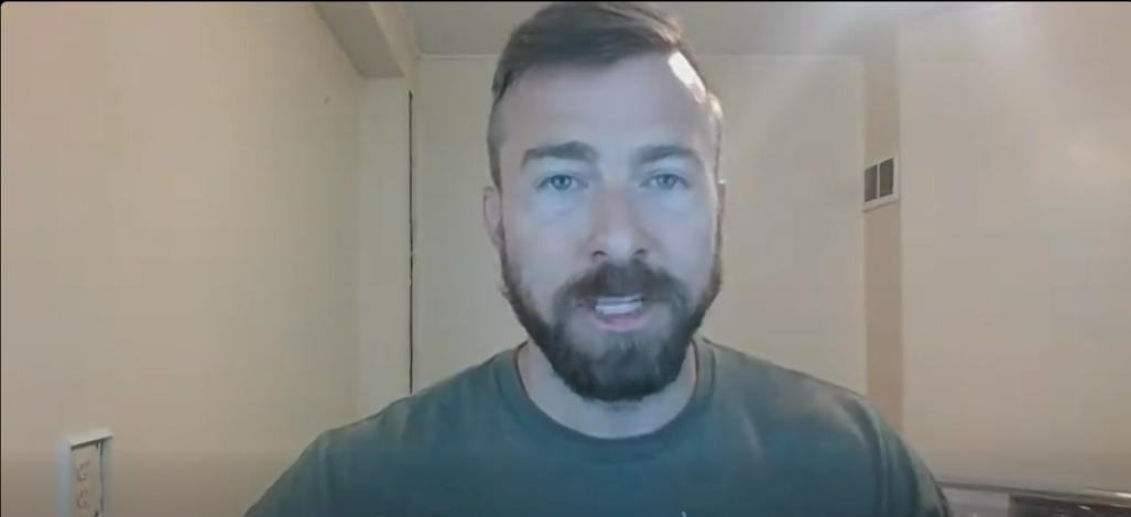 Adam Moore speaking by webcam